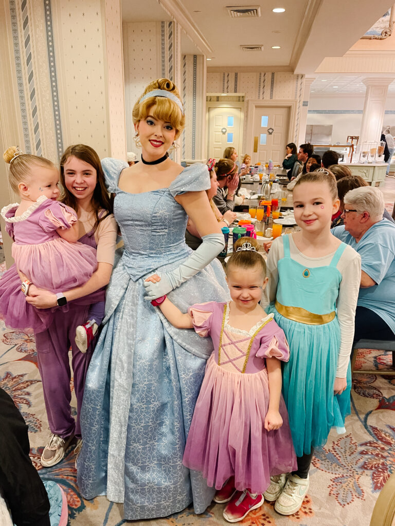 Four girls with Cinderella at 1900 Park Faire Grand Floridian, Character Dining in Disney World
