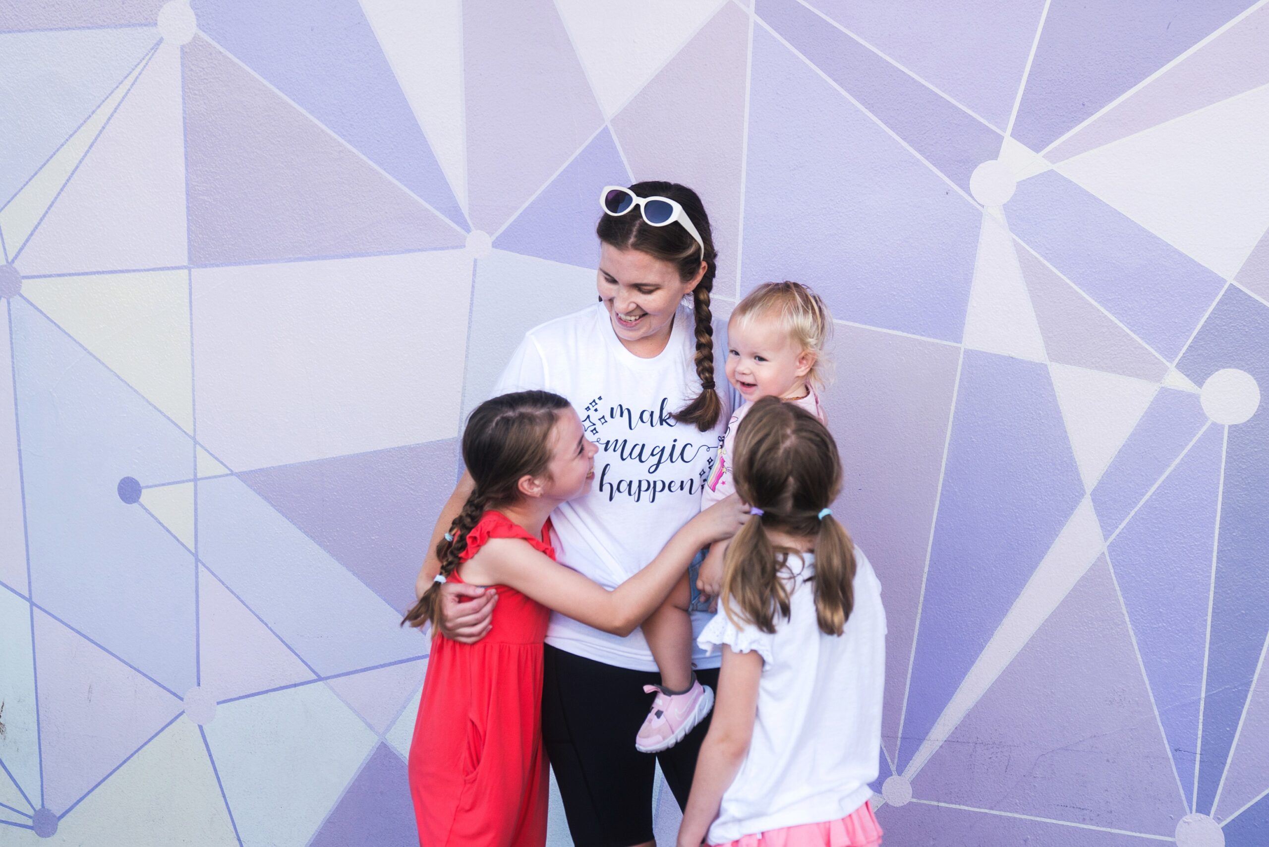 Magic Kingdom Purple Wall photo of mother with three girls, Disney Outfits for Moms