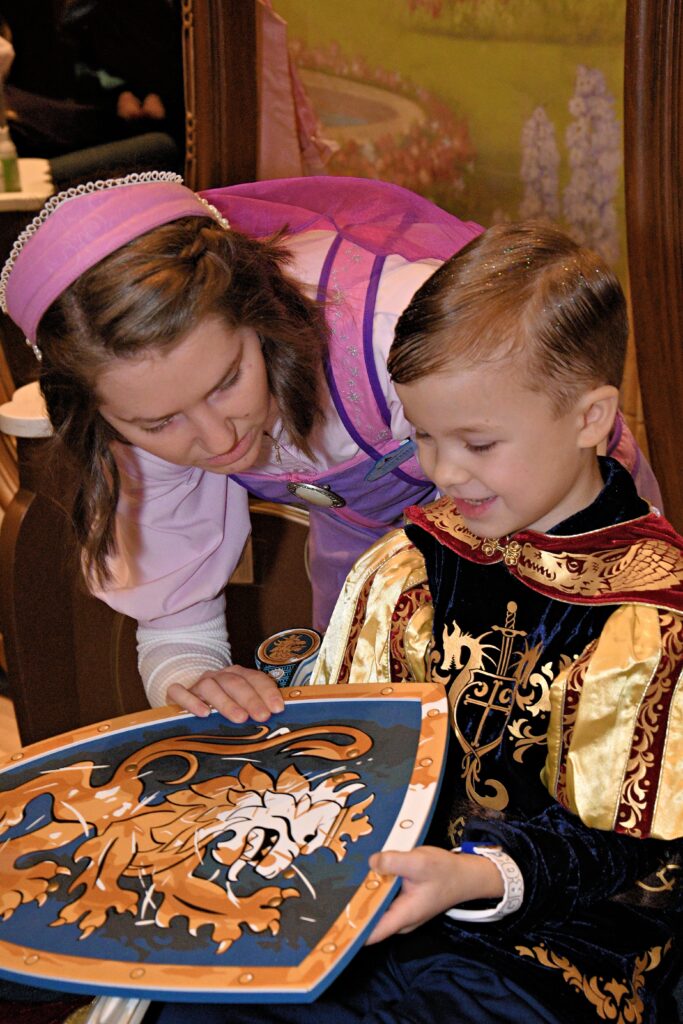 Boy becoming knight at Magic Kingdom