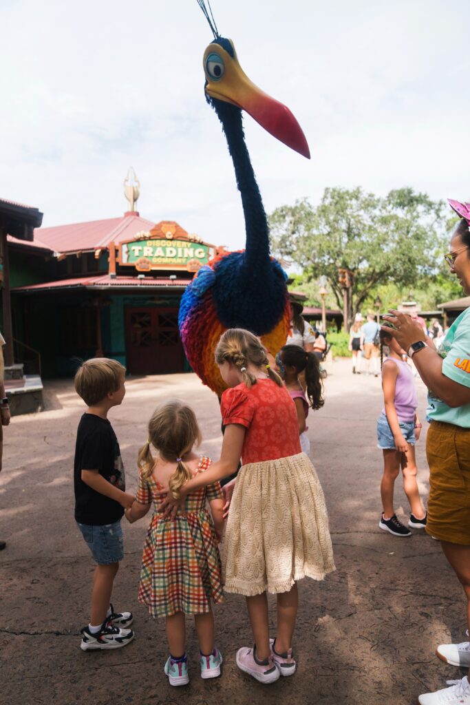 Kids standing seeing Kevin at Animal Kingdom when using lighting lanes